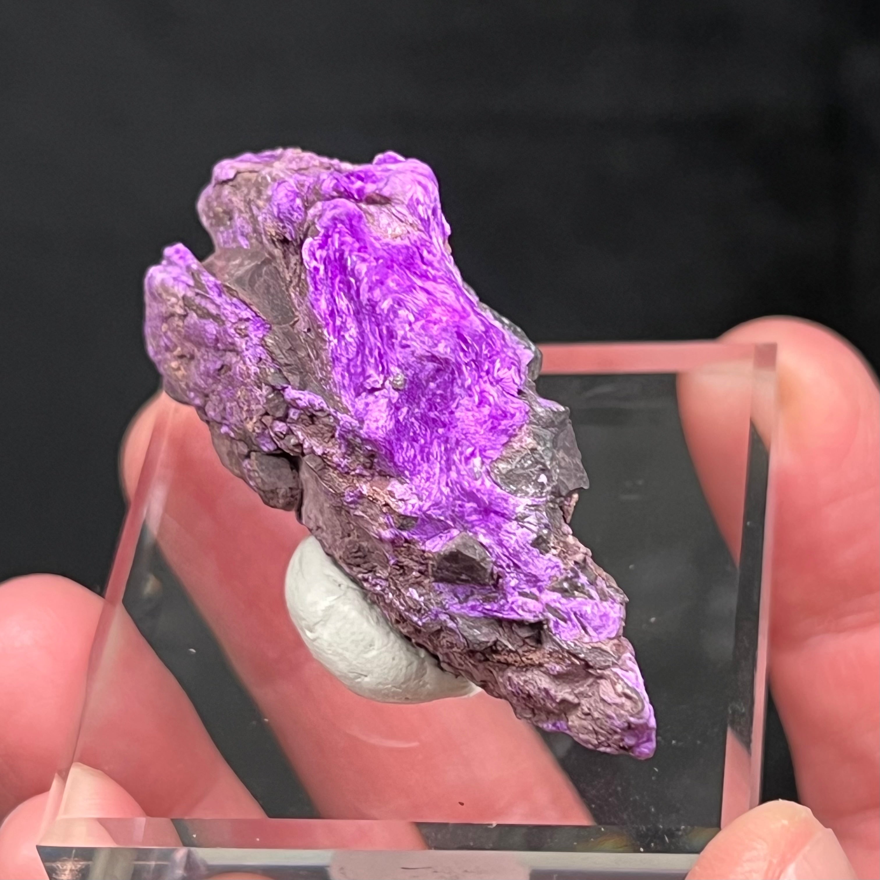 A special release from our private collection. This is verifiably rare, high quality, Fibrous Sugilite, exhibiting a rich violet-purple color with a gorgeous, shimmering chatoyancy.