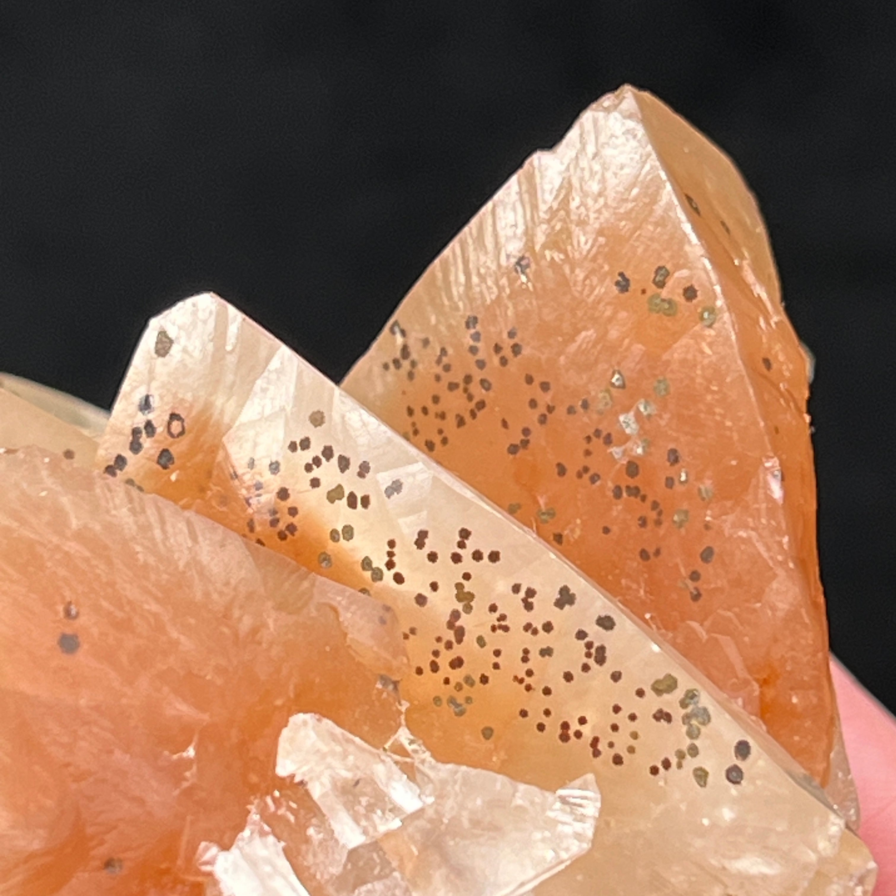 Hematite also is evident in and on the surface of these Calcite crystals in the form of fascinating circular and somewhat plume-like, mossy or flowery looking specks.