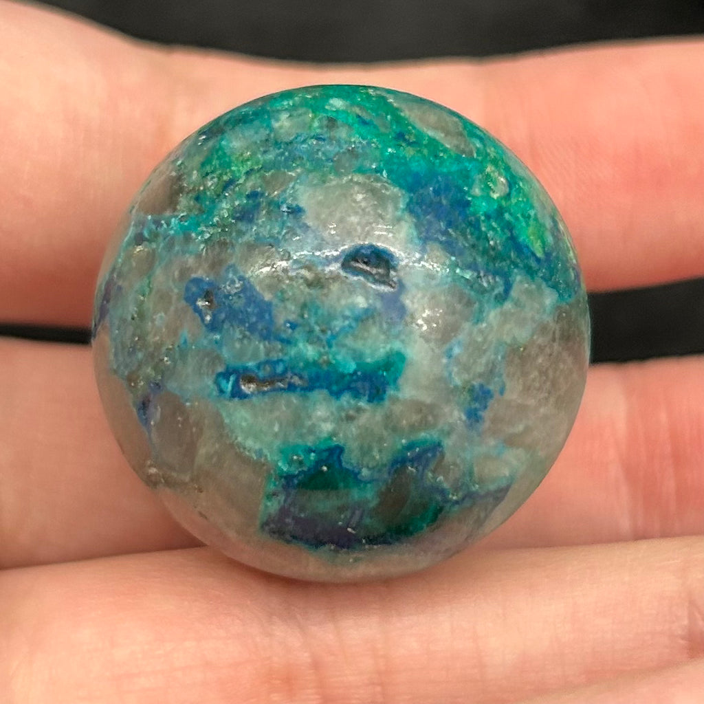 These fascinating Planet-like, polished, mini spheres are from a mineral deposit that may include up to eight different minerals
