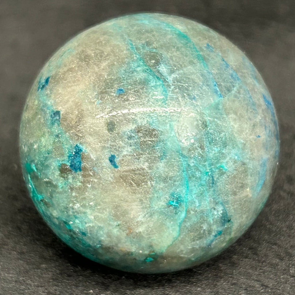 These fascinating Planet-like, polished, mini spheres that we're presenting from our shop are from a mineral deposit that may include up to eight different minerals