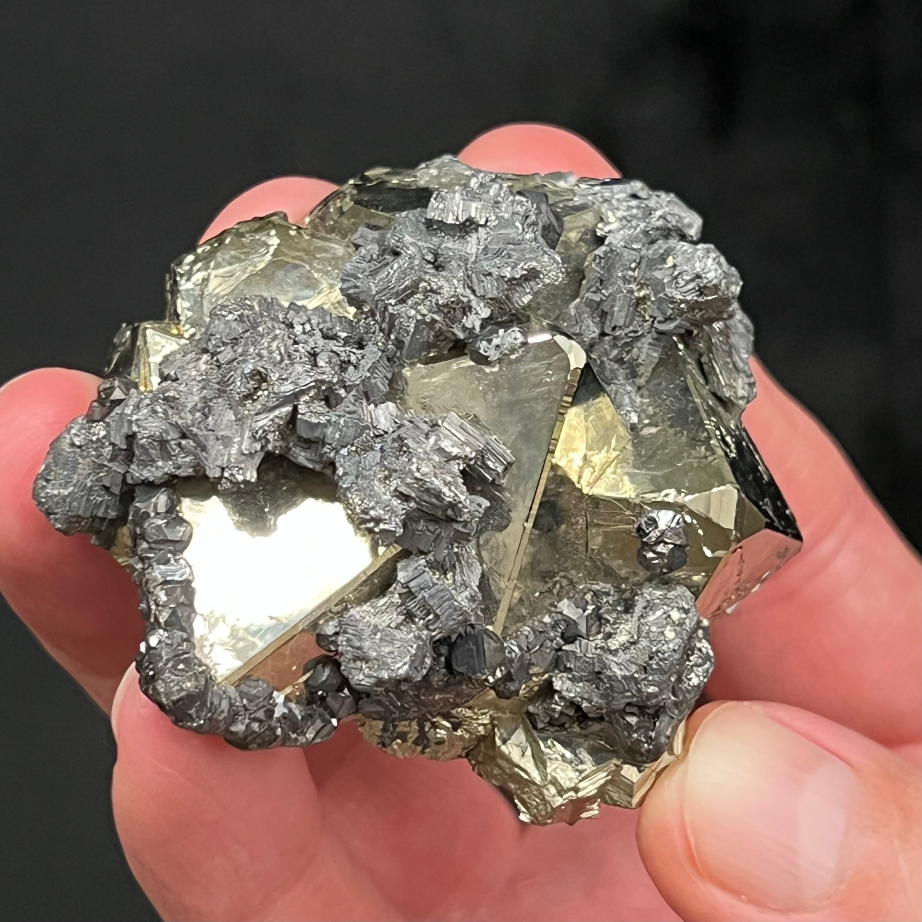 This is a higher quality octahedral Pyrite cluster with excellent bright silver metallic mirror luster. The source for this fine Pyrite is the Huanzala Mine, Huallanca, Bolognesi Province, Ancash, Peru.