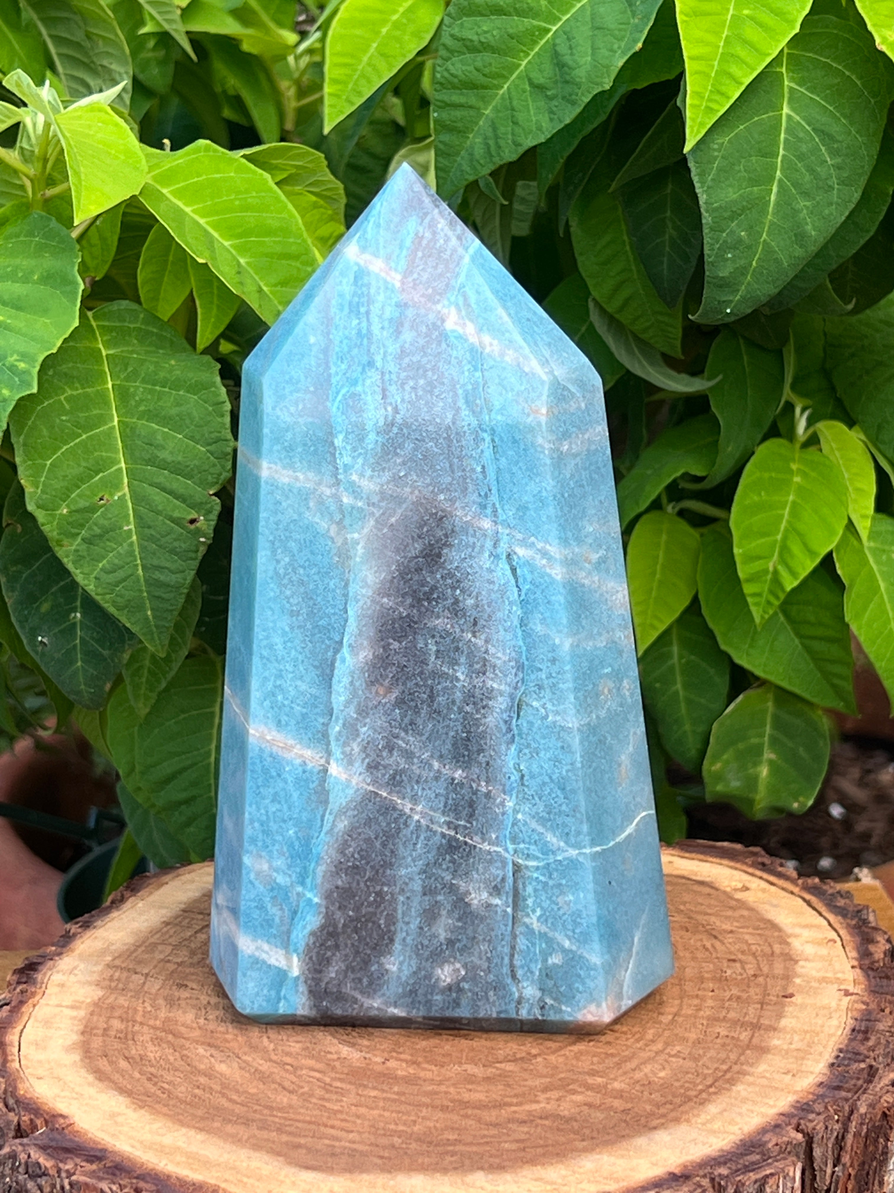Love the gorgeous flowing river design and sky blue to faded denim blue colors in this one! 6 1/2 inches tall. This is a larger size, beautifully cut and polished Trolleite stone tower or obelisk.