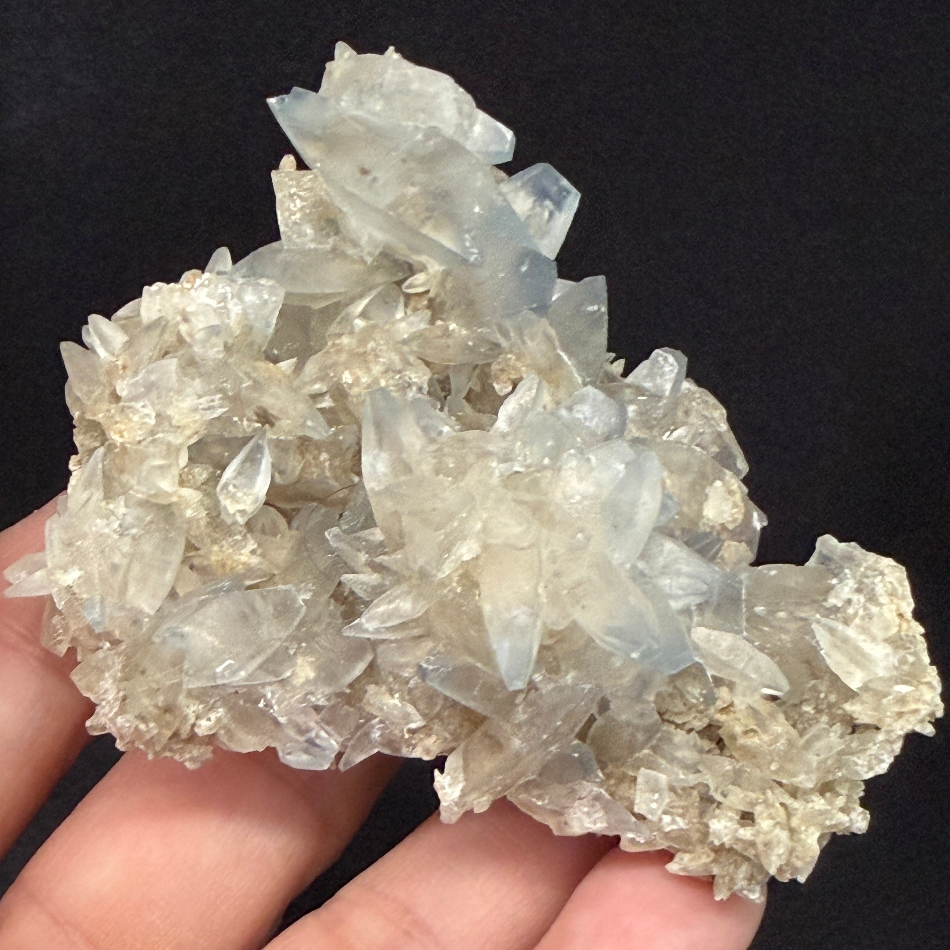 Celestite cluster shown in hand