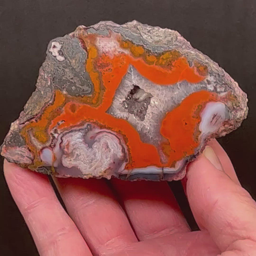 Another fascinating attribute of this excellent example of a Moroccan Agate is the translucency and transparency, i.e. the clear areas of the specimen that are most evident around the beautiful crystalline pocket and the swirling formations. 