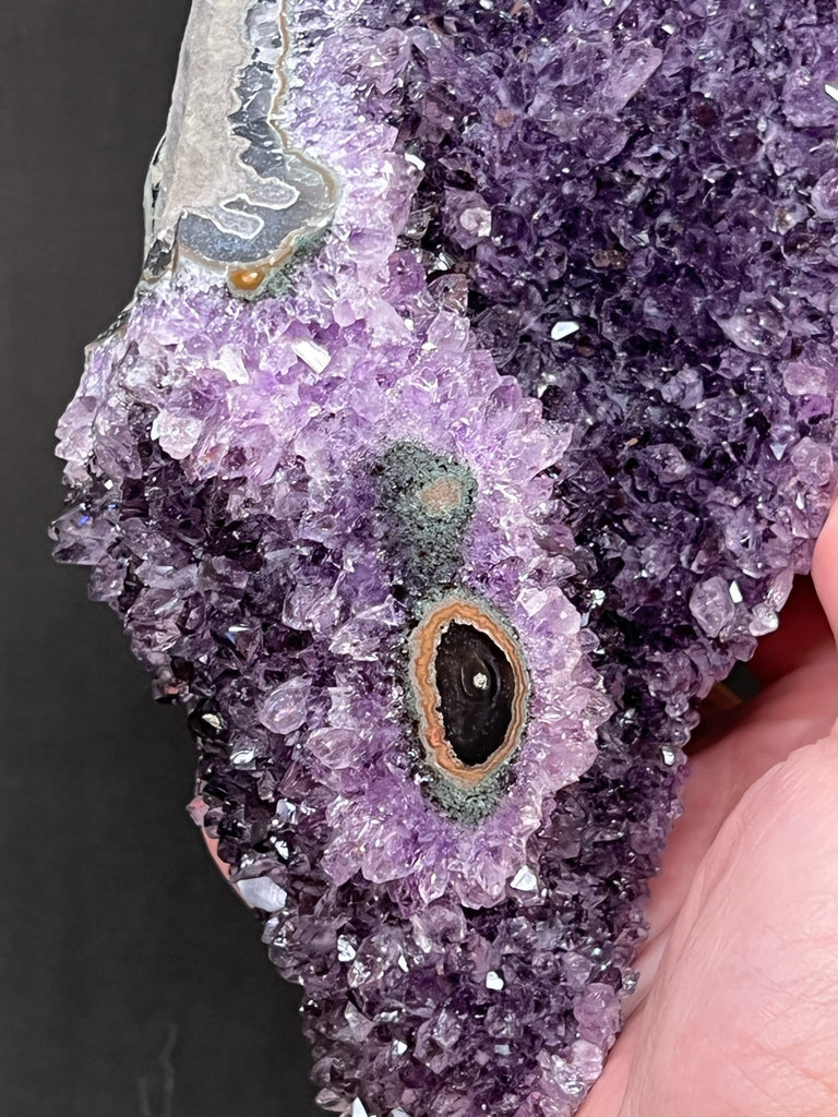 All of the crystals and formations of this exquisite Amethyst Flower Eye specimen are all 100% natural.