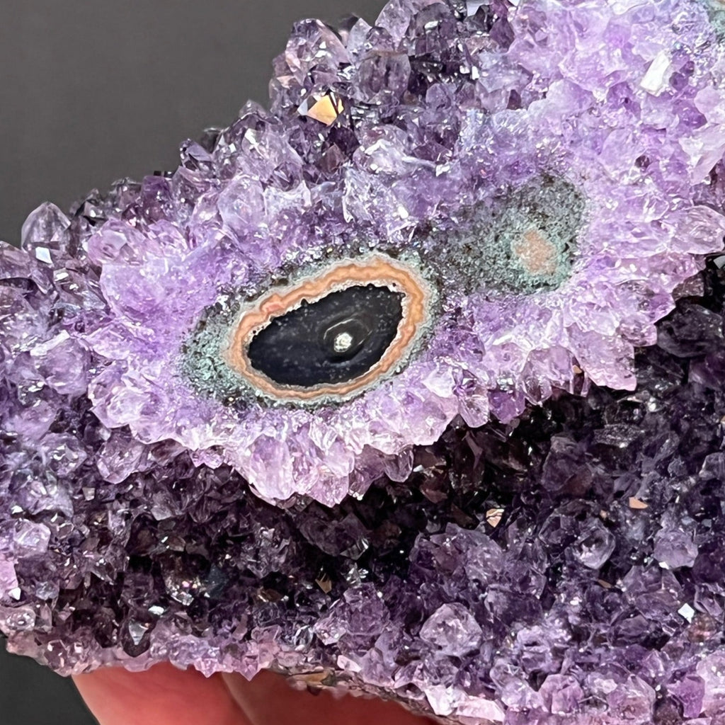 This is a large, sensational, rich purple, lustrous Amethyst Flower Stalactite Eye Formation crystals specimen from Uruguay with a highly polished face to highlight the exceptional banded flower eye structure.