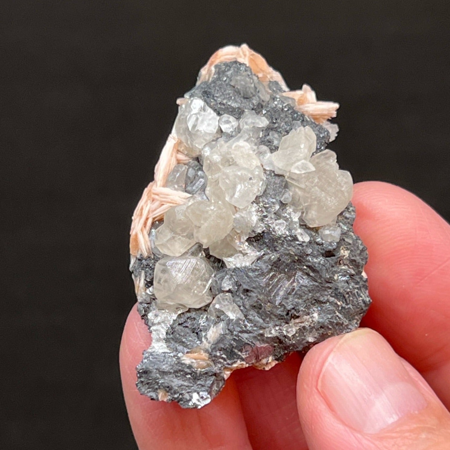 There are at least two and possibly three occurrences of twinning Cerussite crystals growing on this specimen!