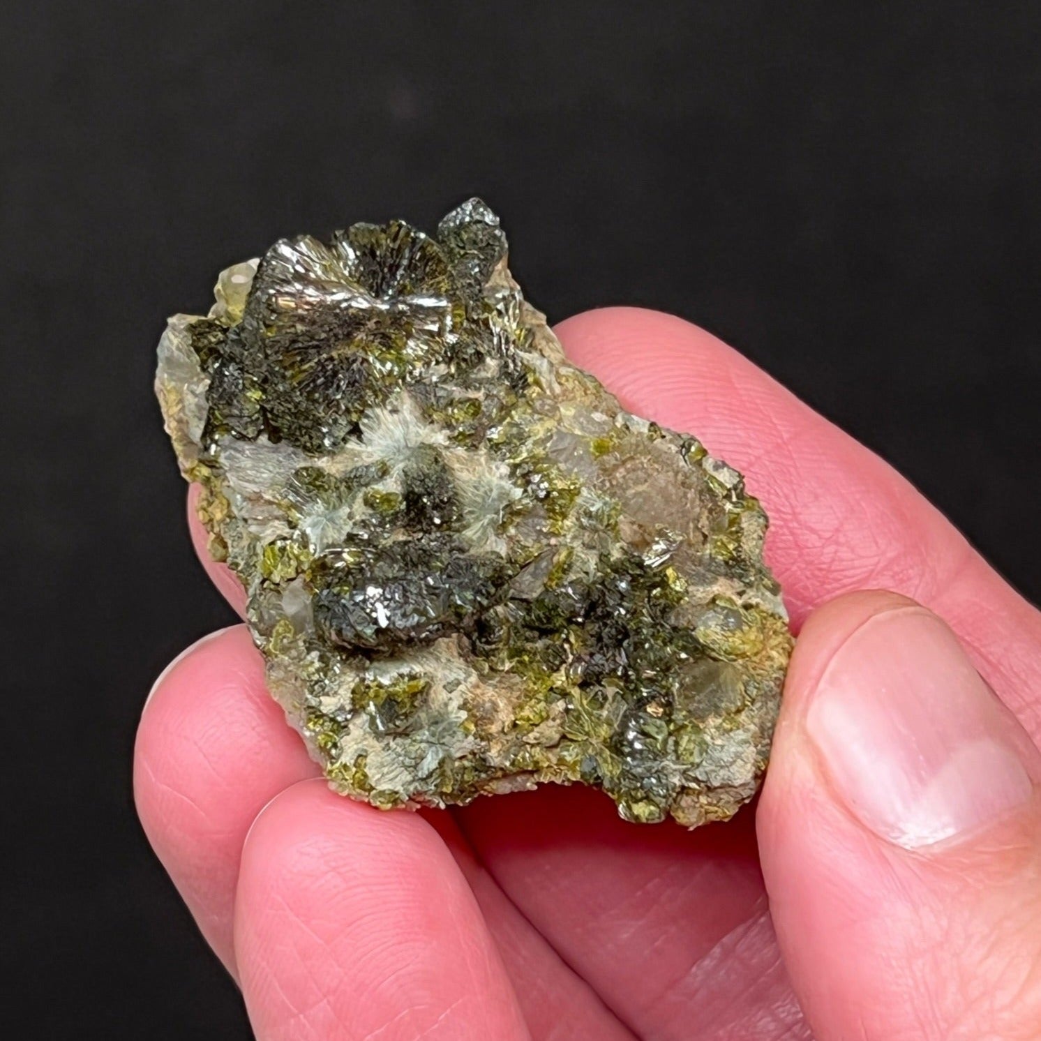 The luster and formation of the Epidote crystals on this specimen are exceptional.