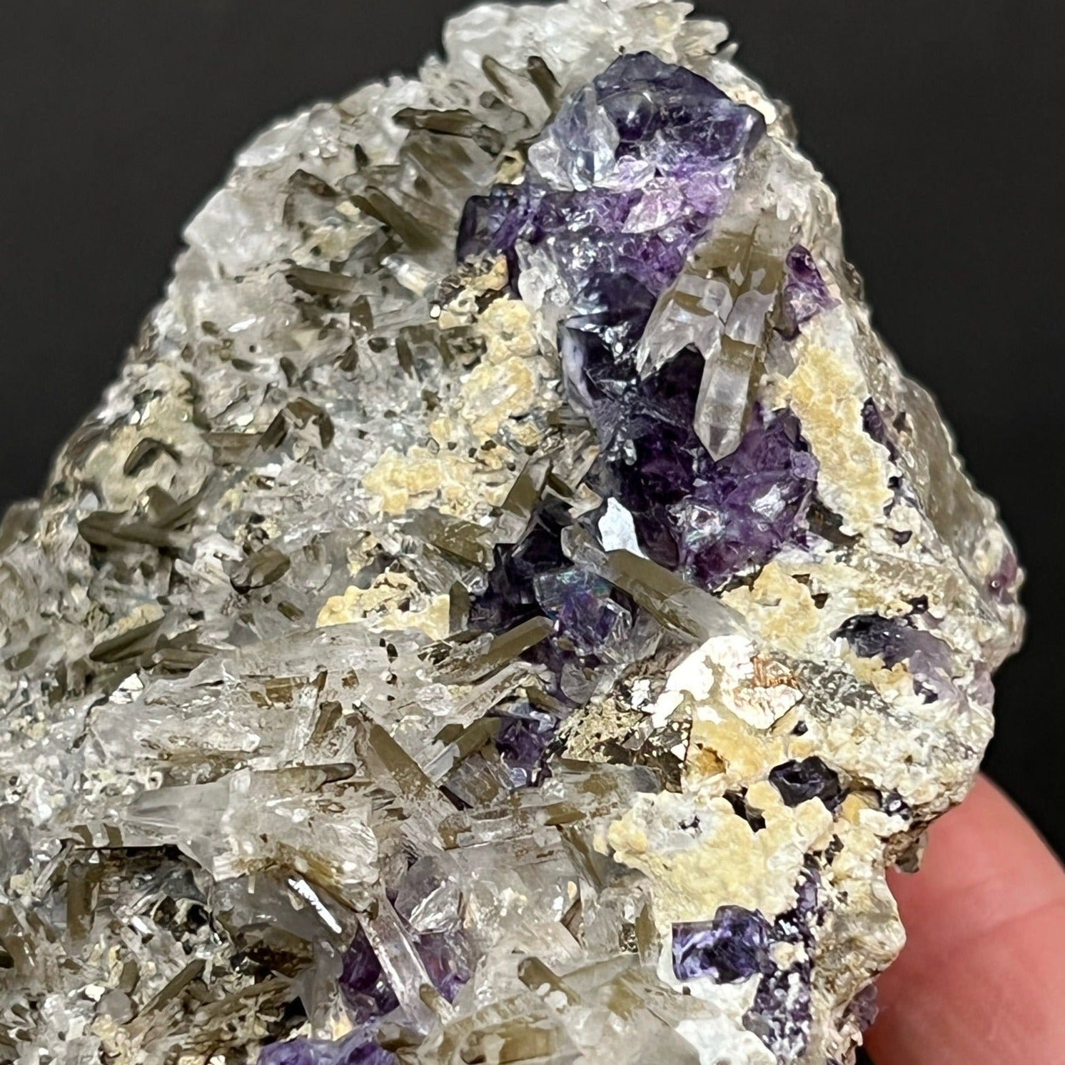 Chlorite tipped Needle Quartz interestingly presents in spaces between the Fluorite and in random directions all around the specimen.