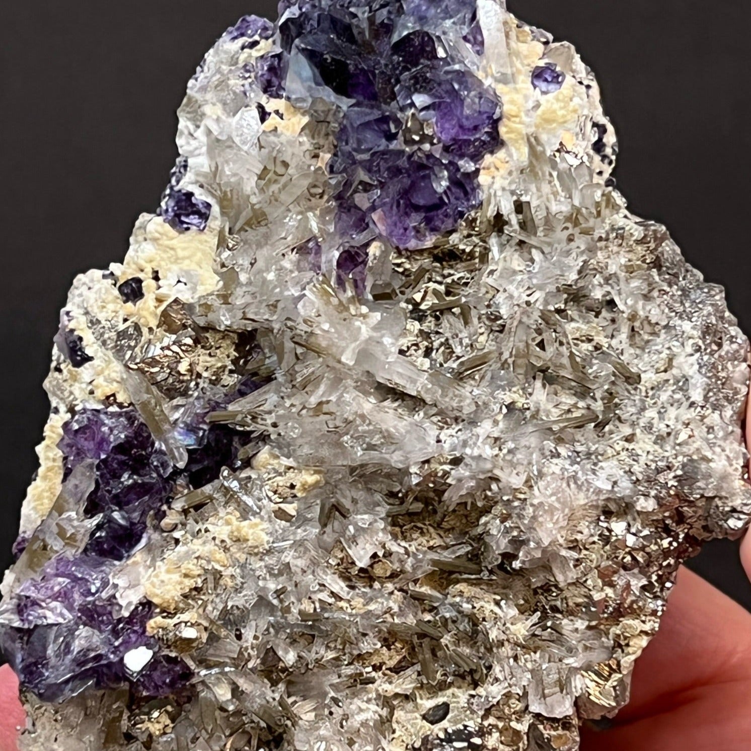 Some of the Fluorite in this specimen presents with fascinating zoning, varying saturations of dark blue, light blue, purple hues with translucent to transparent crystals.