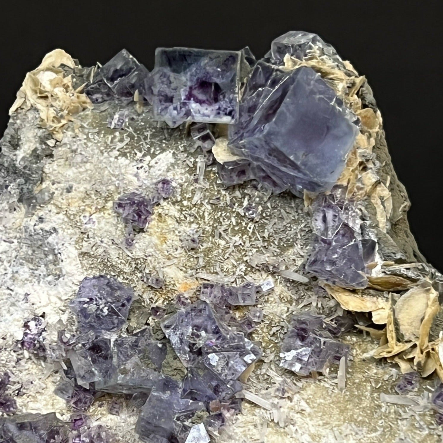 The majority of the edges of the Fluorite crystals are clean and sharp. While there are nicks on a very few of the smaller Fluorite crystals, and some edges may seem irregular, upon close examination the edges are revealed to be etched and stepped in growth.