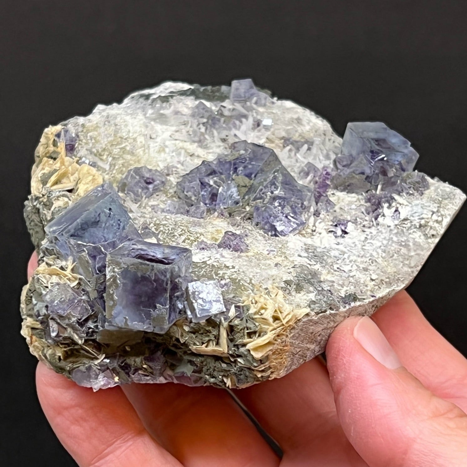 This an exceptional, lustrous, blue-purple, cubic Fluorite with zoned, phantom centers, Needle Quartz, and bladed Siderite specimen.