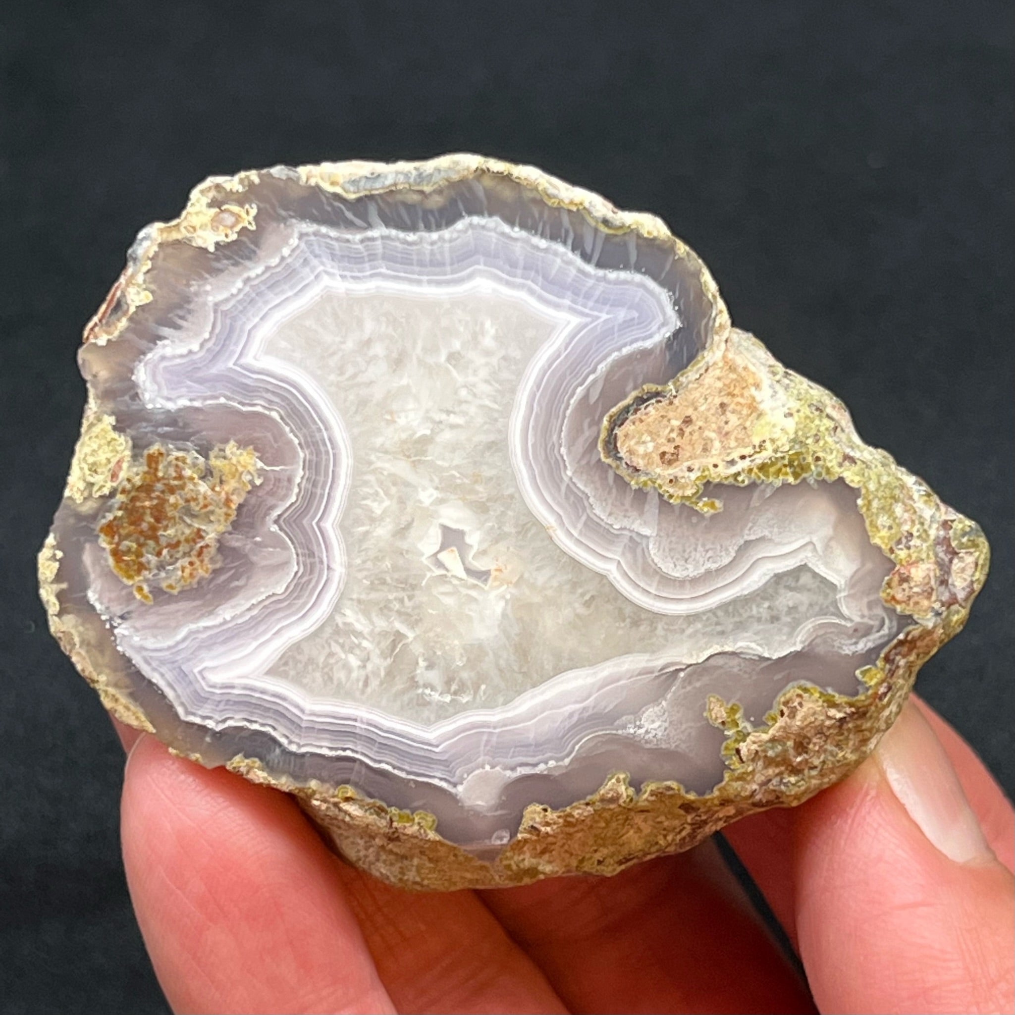 Larger side of the beautiful thunderegg is 124 grams and measures 2.78" x 2.55" x .90" or 70.6mm x 64.8mm x 22.8mm.