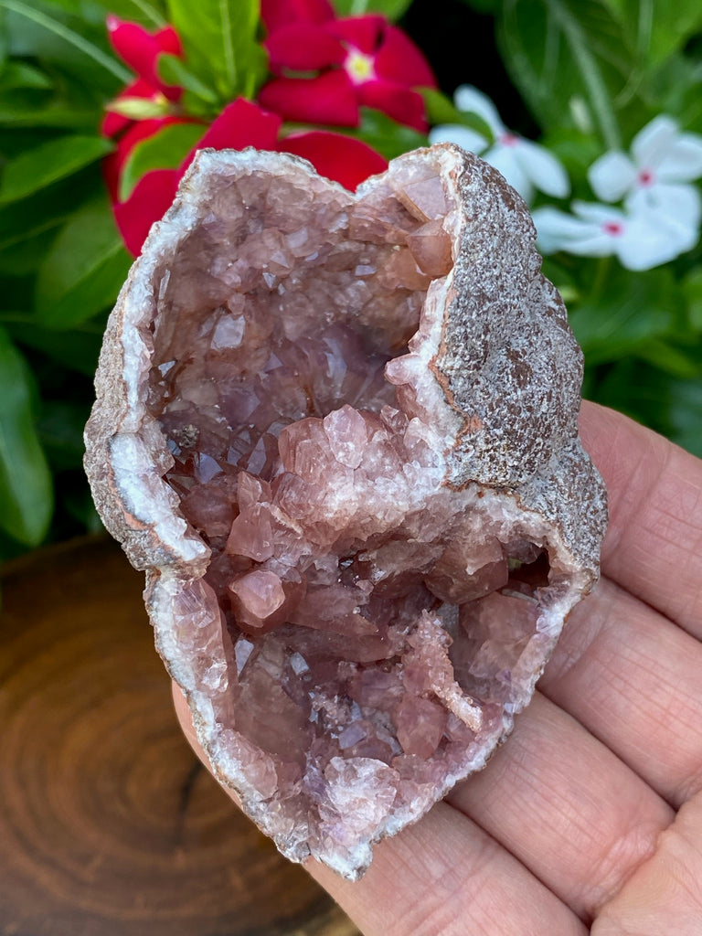 Crystal formations in this beautiful Pink Amethyst double chambered geode range from druzy to prismatic and rosette like with plenty of shine across both sides.