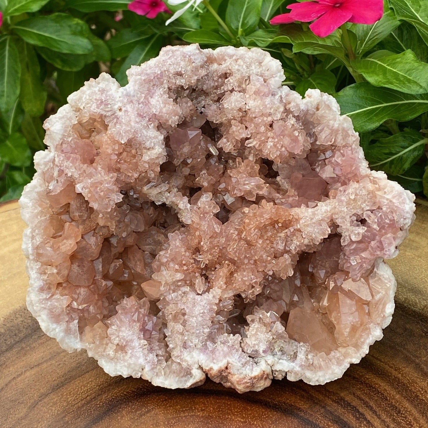 The color of the crystals present with less hematite (redish color) staturation, and as a result, the crystals are a gorgeous, softer light pink, pink and peachy-pink.
