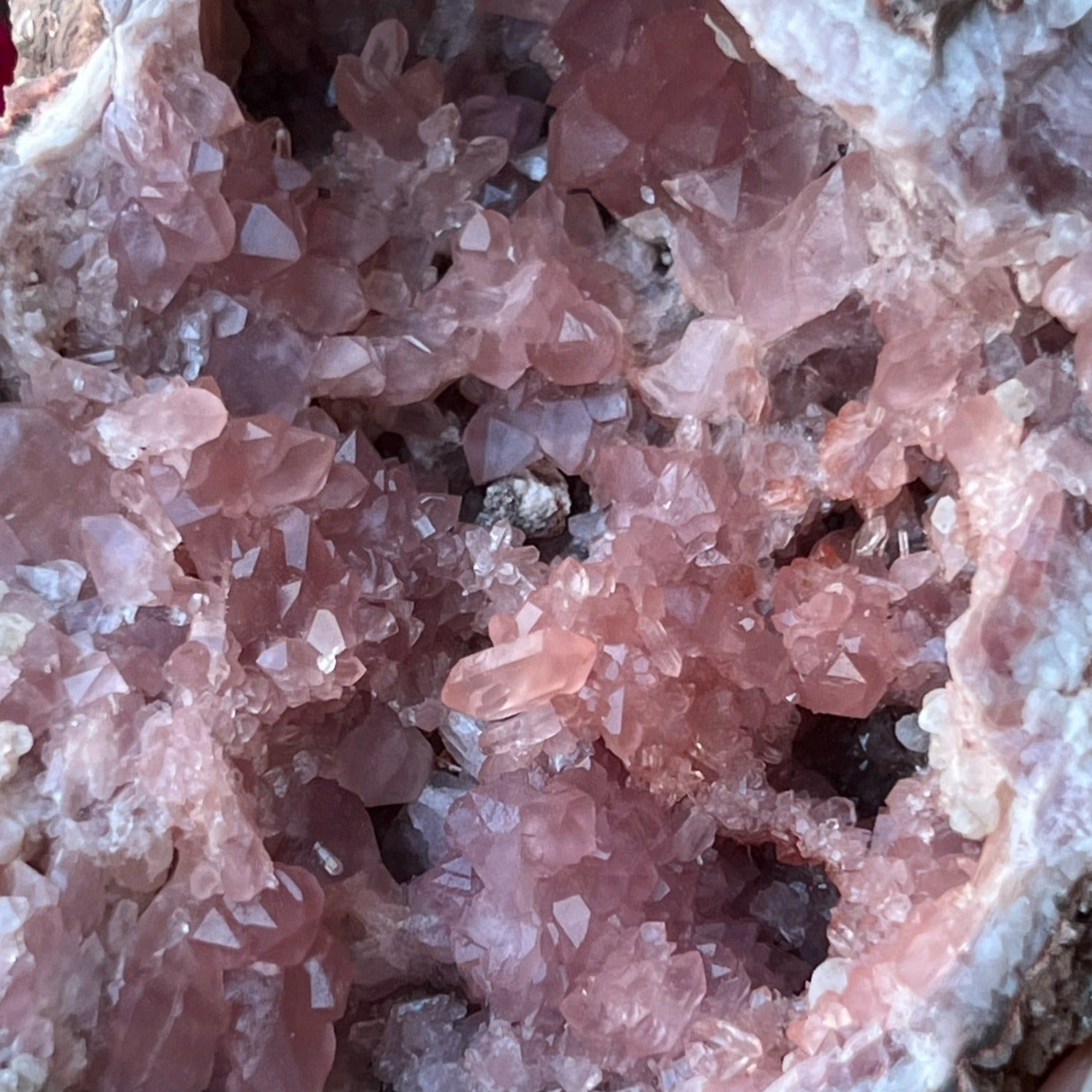 The most prominent, beautiful feature of this fine Pink Amethyst Crystal Geode specimen is the raised stack of crystals near the center of the pocket that includes multiple double terminated crystals, one perched right on top of the formation!