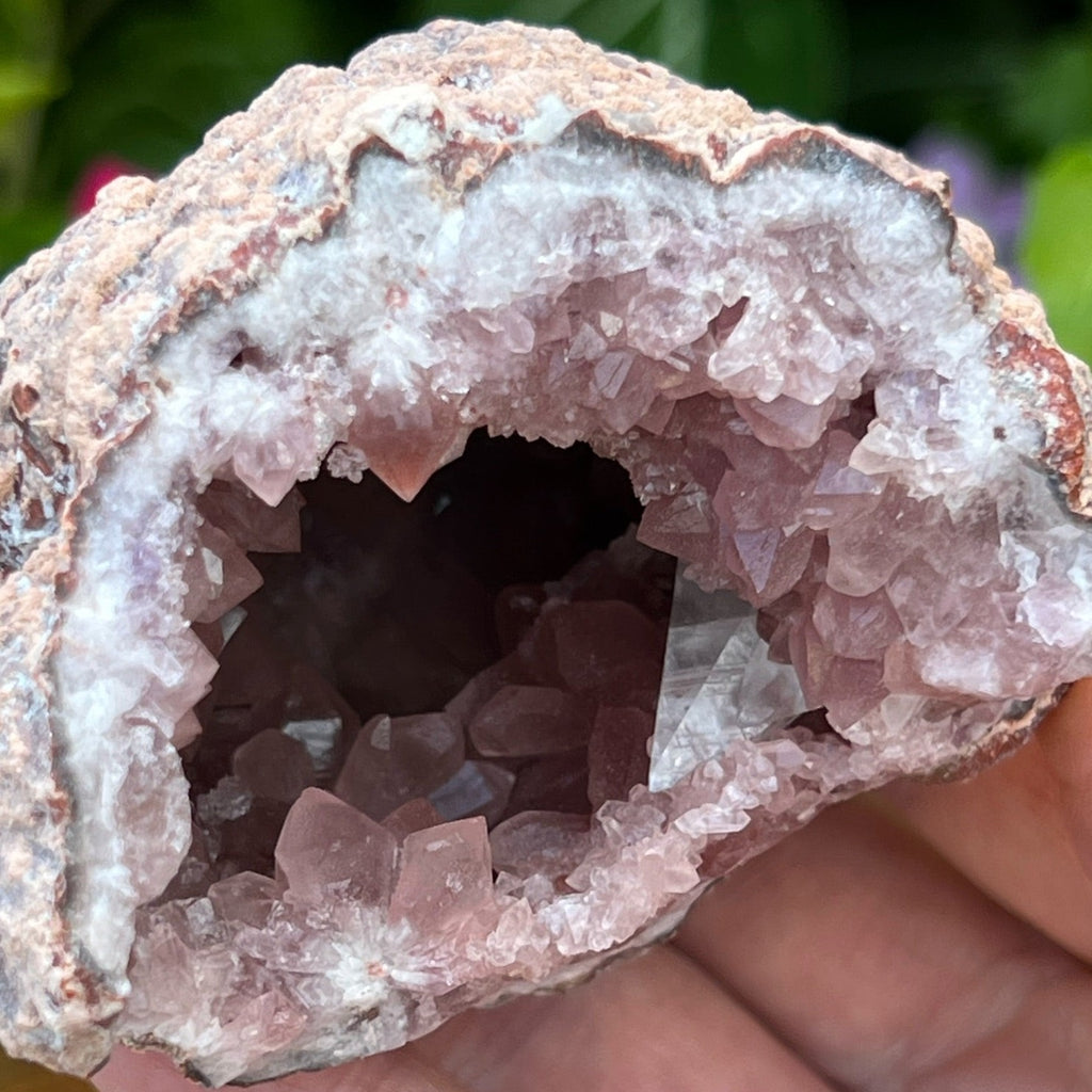 Exquisitely formed, the clarity and extreme luster of the larger Calcite crystals is truly remarkable as they present near the edge of this Pink Amethyst Crystals Geode specimen!