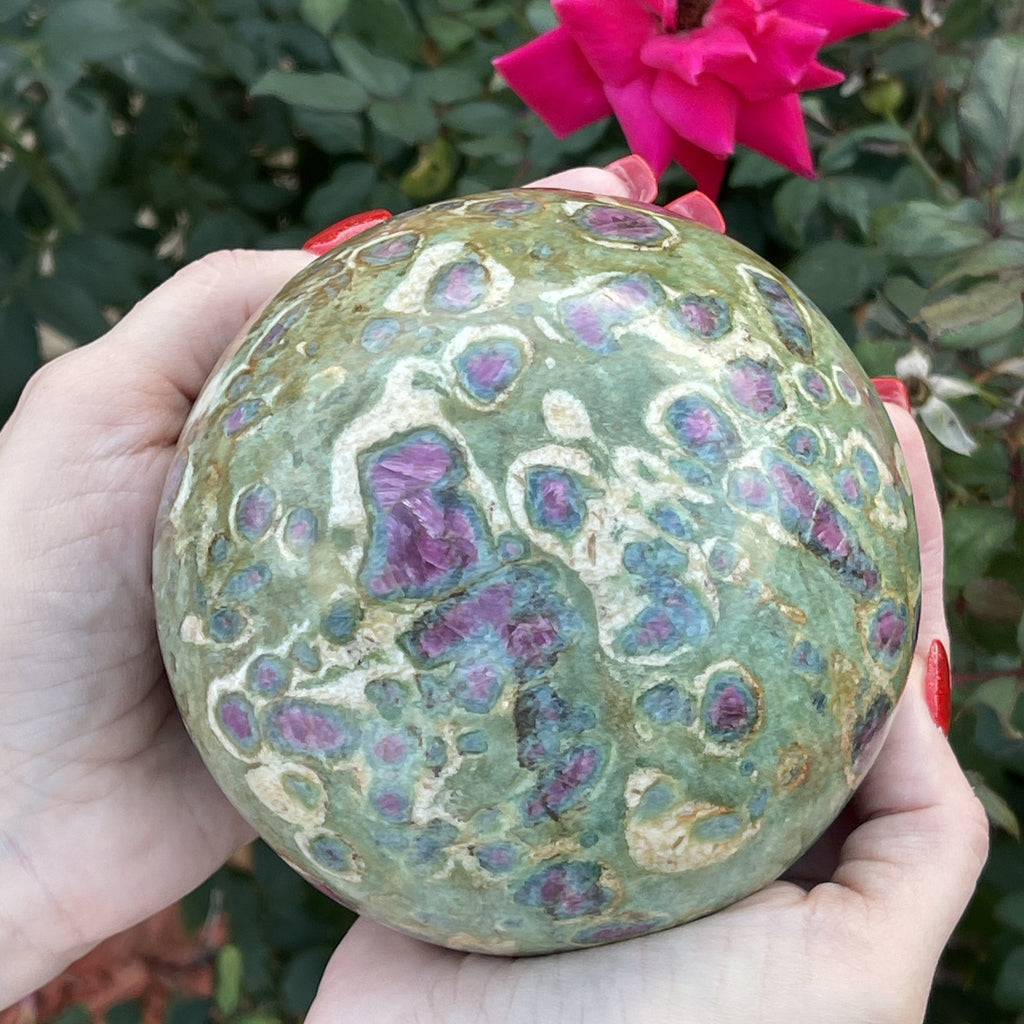 This is a beautiful, large, high quality, polished Ruby Fuchsite with Kyanite, almost 5 pound sphere, displaying a widespread dispersion of intense red and red-violet ruby all around the gorgeous green colors of the fuchsite with Kyanite surrounding some of the Ruby.
