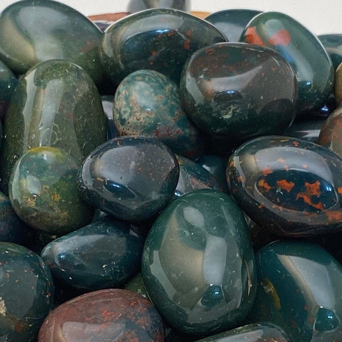 Bloodstone polished small to medium tumbled stones.