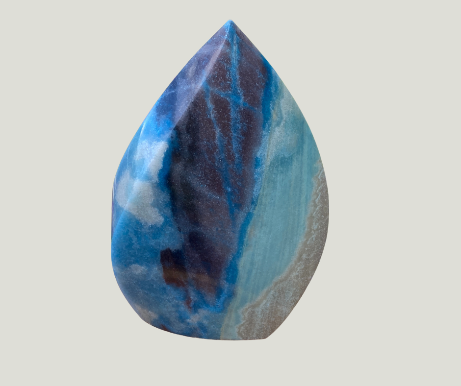 Trolleite A Master Ascension Stone. This is a large polished flame with beach colors of blue and sand.