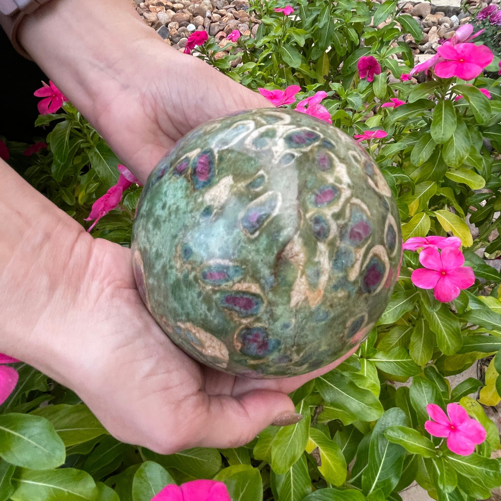 The rubies in this beautiful, large Ruby Fuchsite sphere are surrounded by layers of gorgeous blue-green Kyanite.
