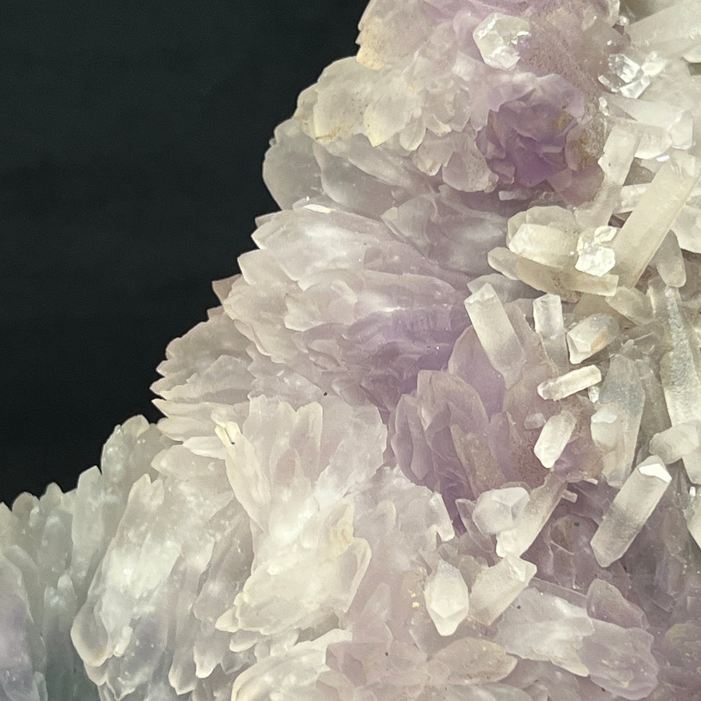 A majority of the faces on the terminations of the Calcite crystals on this Amethyst Flower specimen have excellent luster, show a beautiful shine. 
