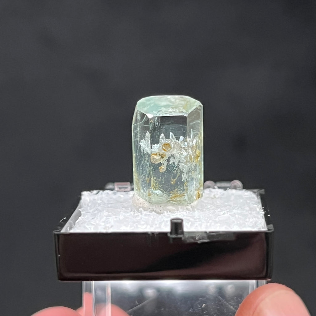 This is a beautiful example of Aquamarine with a less common occurrence of a Quartz cluster inclusion.