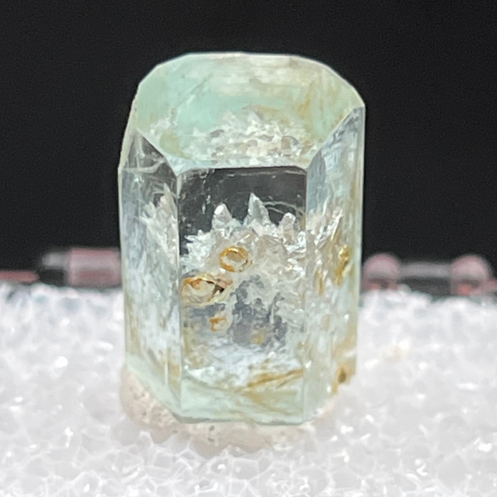 Due to the excellent clarity of this Aquamarine piece, the terminations of the quartz included in this piece are clearly visible.  