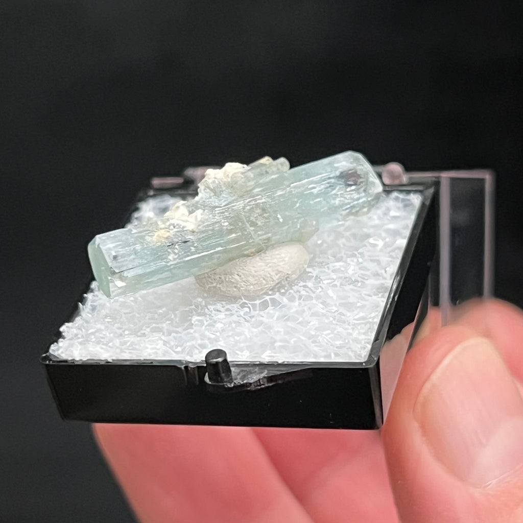 This is a fine example of Aquamarine that is double terminated with secondary growth crystals clinging to the sides of the piece. 