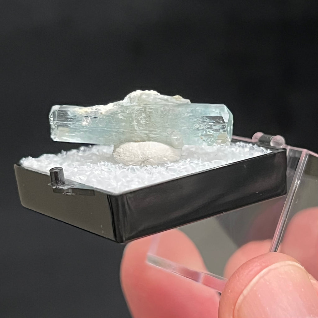 Both terminations of this Aquamarine appear well formed and damage free with a trace of microcline along some of the edges. Some microcline presents in the center area of the piece. 