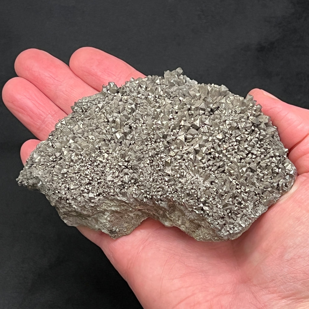 This is a large, excellent example of a plate of an incalculable number of Arsenopyrite crystals exhibiting pseudo-octahedral morphology, some elongated, and with characteristic steel gray color and metallic luster.
