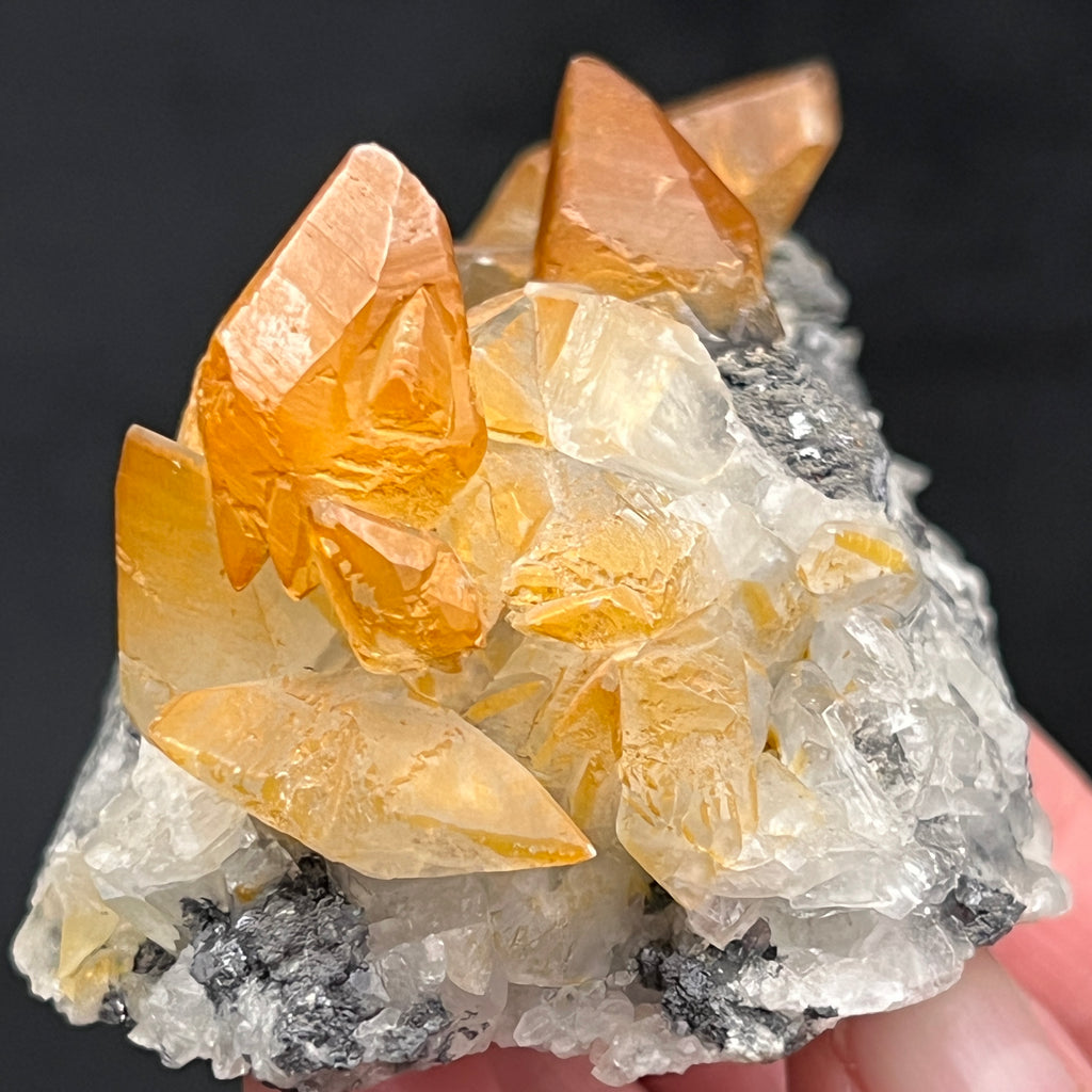 This is a beautiful location piece, exhibiting a less common variety of red-orange hematite included scalenohedral Calcite crystals, some twinned, including butterfly twinned crystals with Galena on matrix from the San Giovanni Mine in Italy.