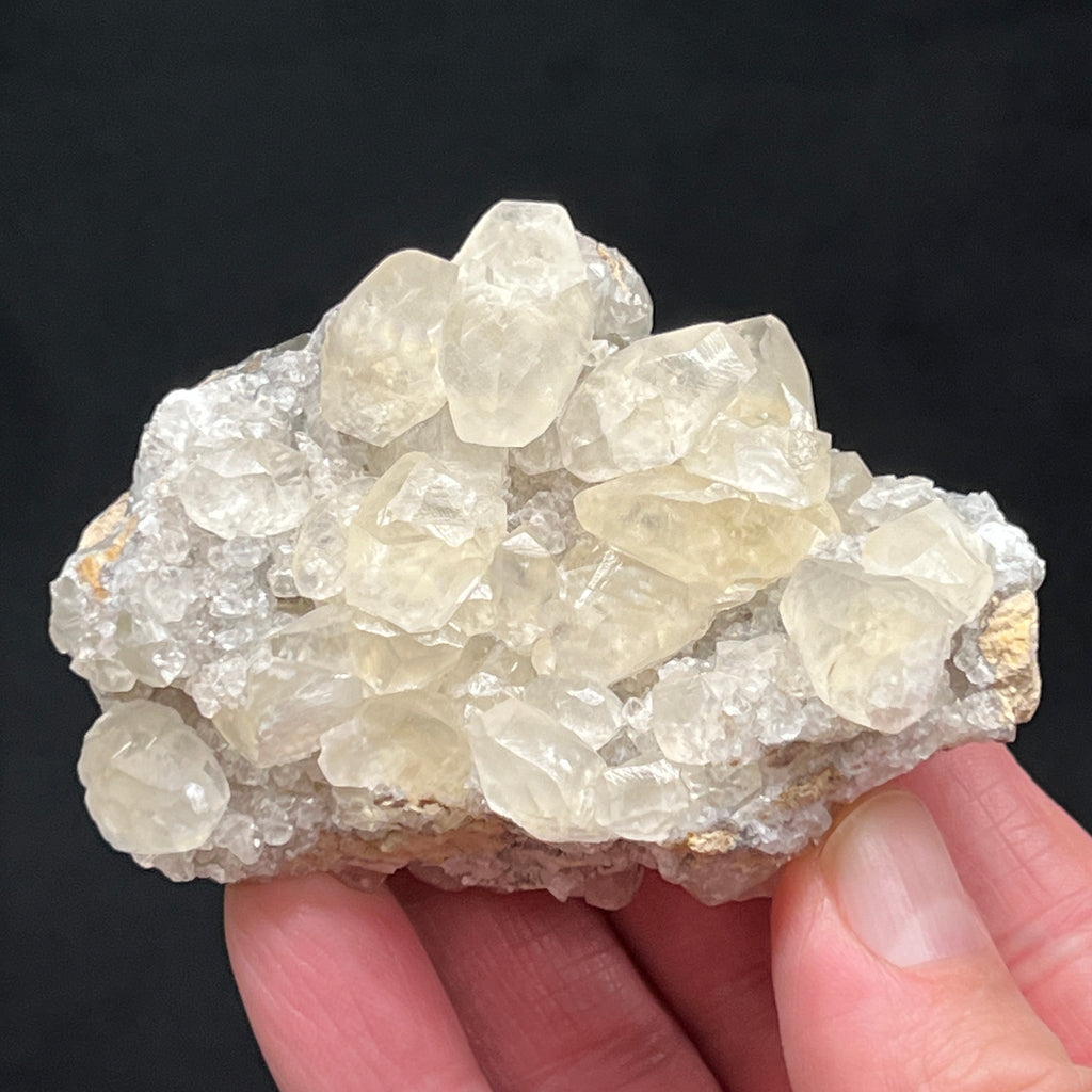 This is an attractive USA location piece, exhibiting rhombohedral, scalenohedral Calcite, translucent to transparent barrel shaped crystals, many of which are double terminated.