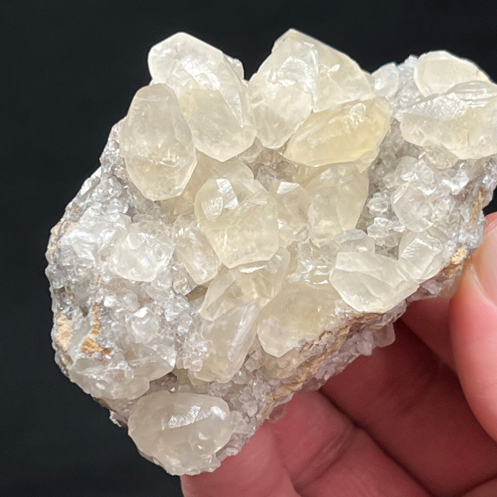 These Calcite crystals from Mt. Pleasant Mills, Pennsylvania present on what could be called the underside and the topside of this specimen.