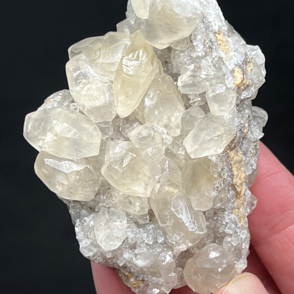 There is a sweet shininess to the Calcite crystals all around this piece.