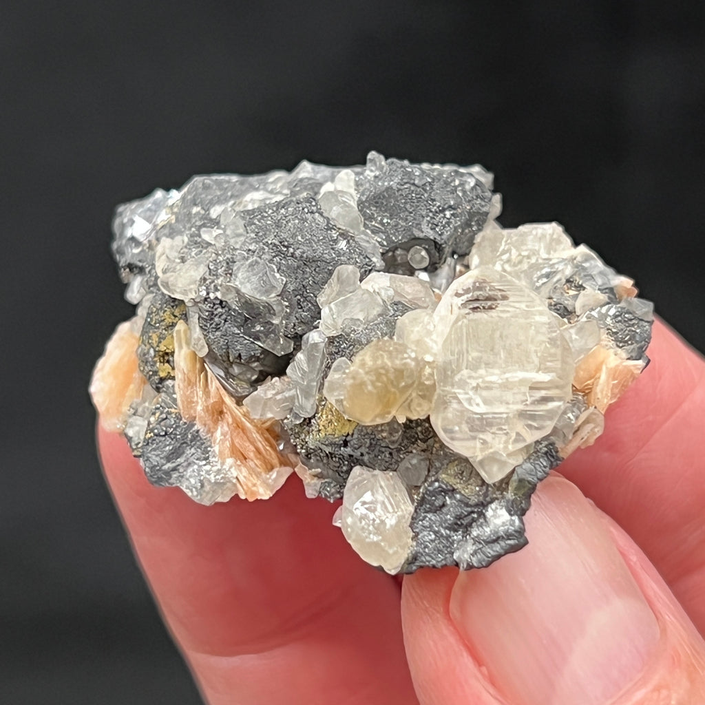 This is an excellent Cerussite with Barite on Galena piece! Twinned, translucent Cerussite crystals are growing perched and nestled amongst blades of orange-pink Barite and gray-black to metallic luster Galena.