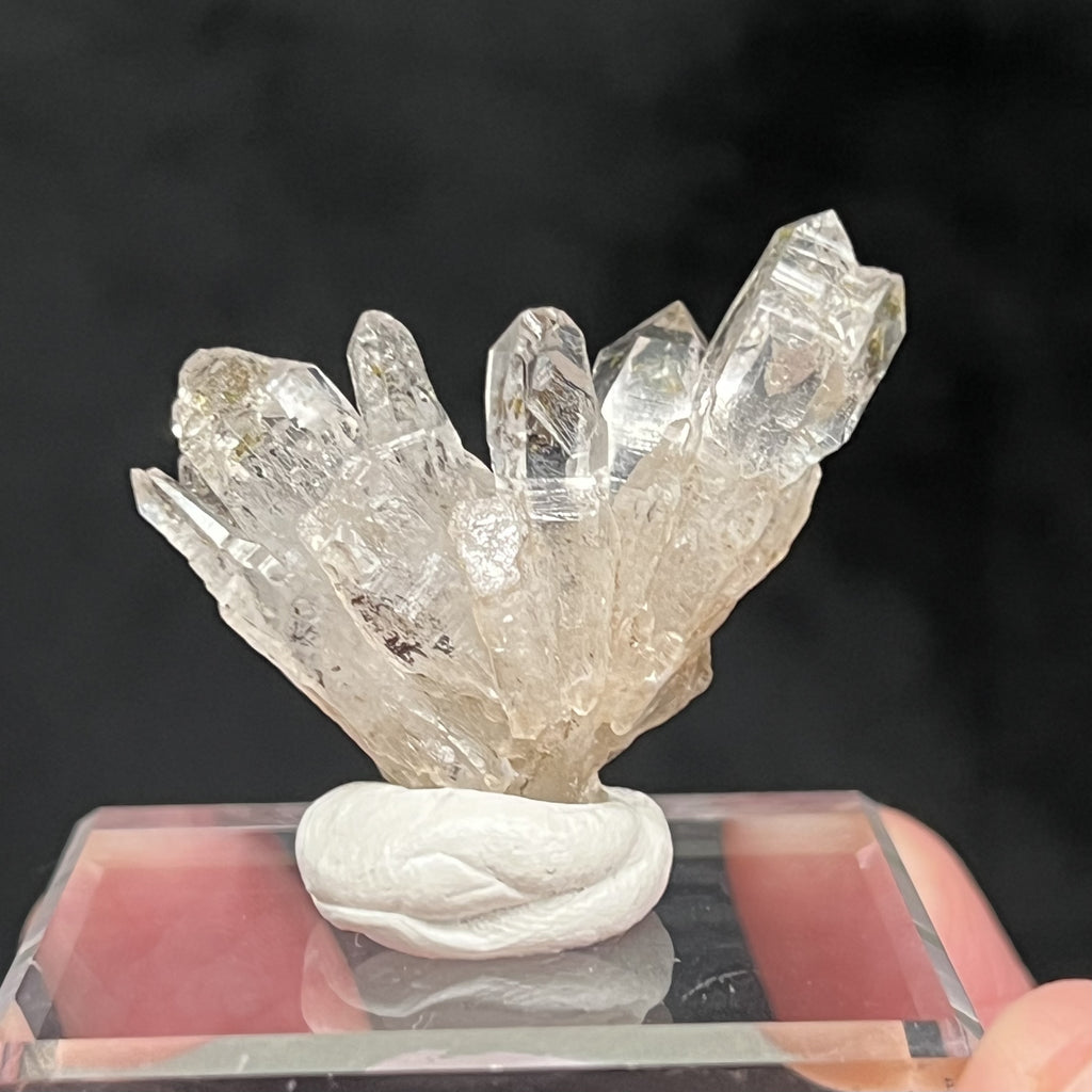 Fascinating growth patterns, some striated, are evident on the facets of the Quartz crystals in this cluster. Some terminations are complex due to the hoppered growth influence, appearing almost skeletal. 