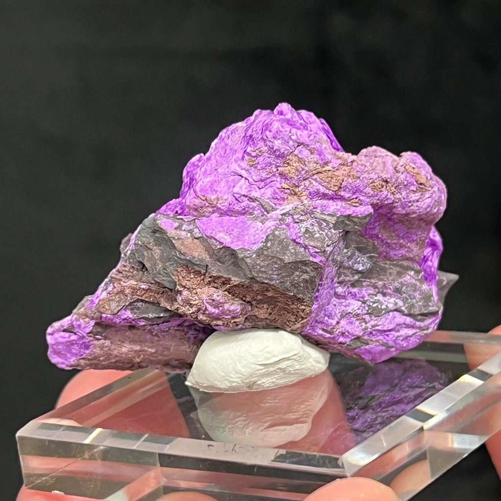Excellent quality. Over two inches in length, a good size piece considering the challenge to find substantial quantity with quality of Fibrous Sugilite from the N'Chwaning III Mine.