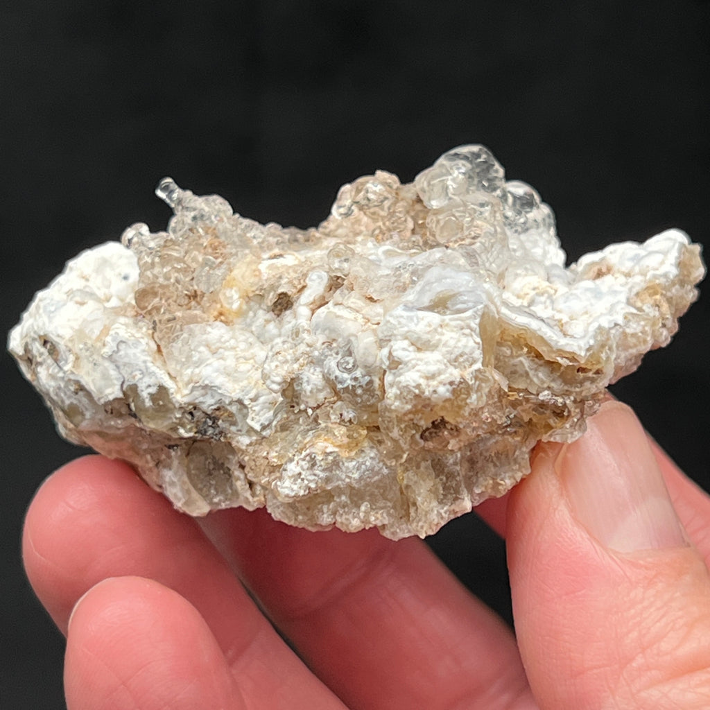 This Hyalite Opal is growing on a layer of equally captivating botryoidal white quartz var. chalcedony that has only a very small amount Rhyolite tuff matrix on the bottom of the piece. 