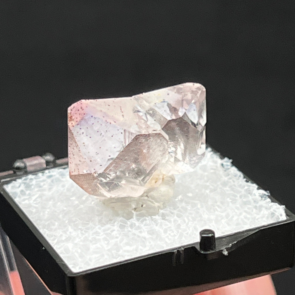 The peppering of minute, very small specks on the facets and faces of the crystals in this Japan Law Twin is the added bonus of Goethite. 