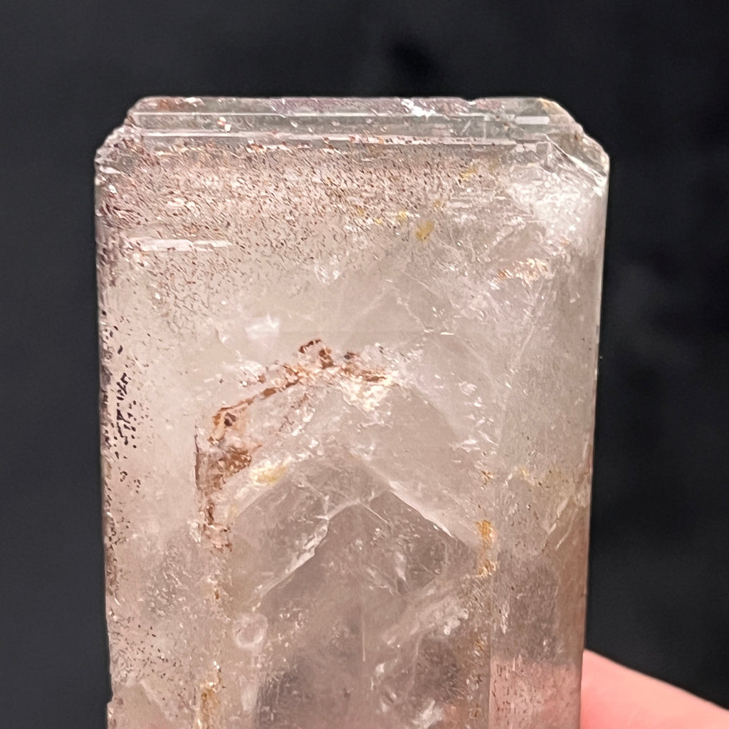 This photo shows the incalculable number of hair like and speckled inclusions in one of the beveled terminations on this very rare barite.