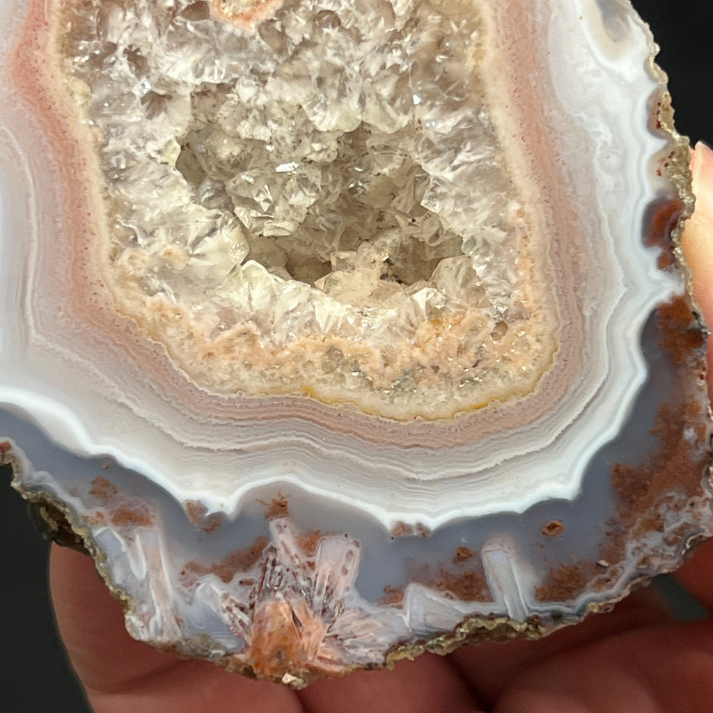 Some of the excellent features of this agate from Morocco include detailed, layered banding and the appearance of rarer pseudomorph agate, or stick agate occurrences on each end of the piece.