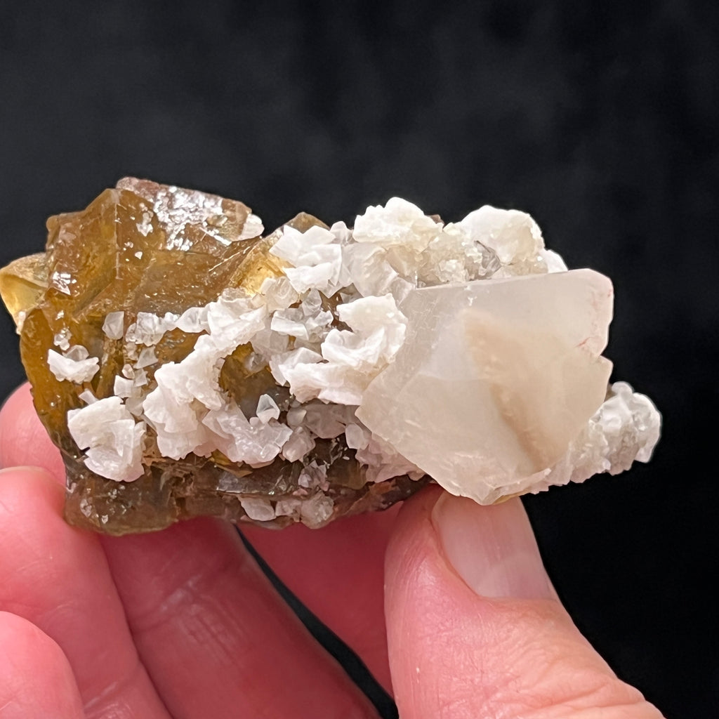 There appears to be an inclusion of another mineral in the Calcite in this outstanding Moscona Mine piece.  