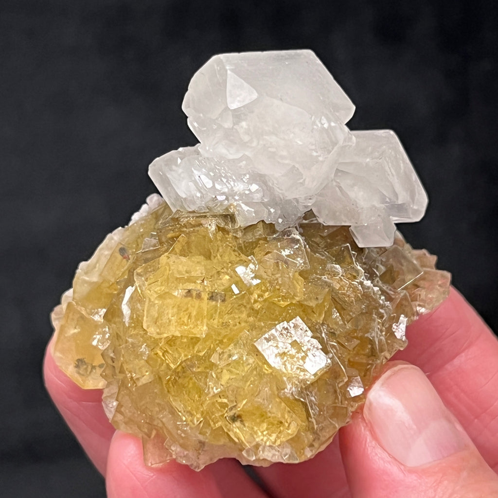 This is a gorgeous, higher quality example of yellow cubic transparent Fluorite with Calcite perched prominently on the piece. 