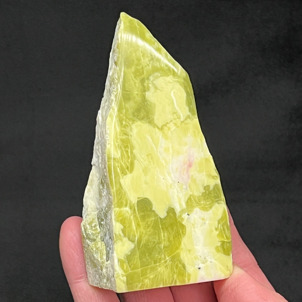 This is an excellent representative of a 100% natural Noble Serpentine piece with a polished front and back, wonderfully raw on the sides.
