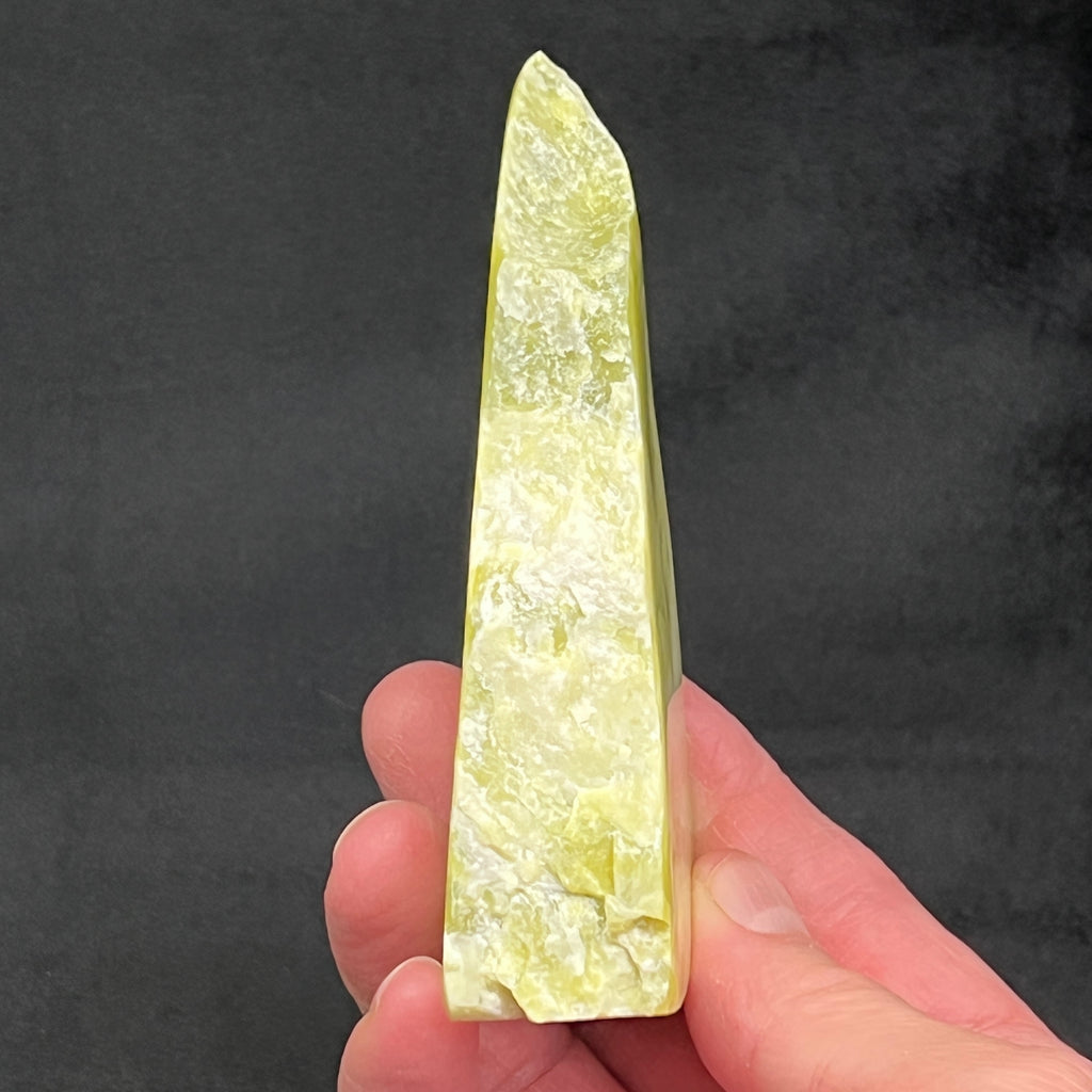 This photo presents a side view of this excellent, 100% natural Noble Serpentine piece with a polished front and back, and wonderfully raw on the sides.