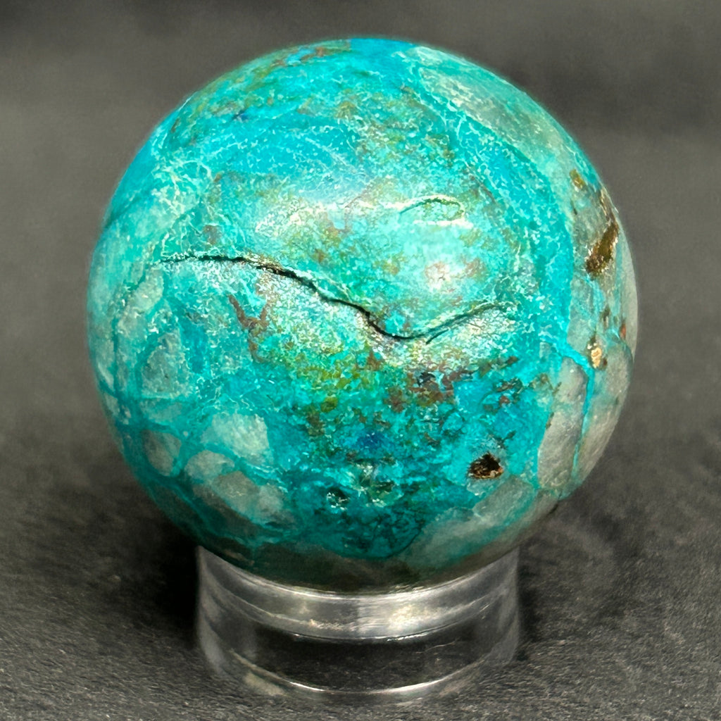 These fascinating Planet-like, polished, mini spheres that we're presenting from our shop are from a mineral deposit that may include up to eight different minerals