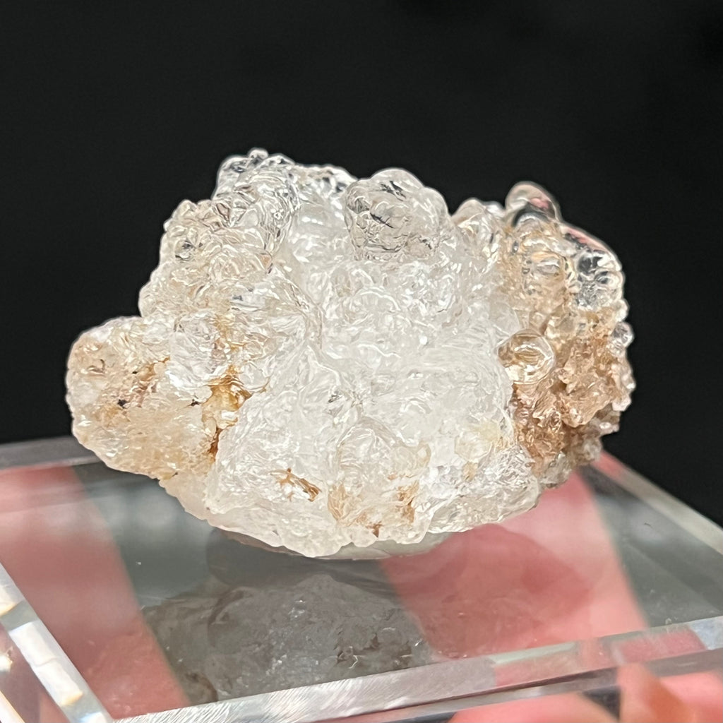 The botryoidal spherules are a hydrated silicate or solidified silica gel containing about 3 to 8% water. The solidification of Hyalite Opal culminates to a hardness of 5 to 6.5 on the Mohs scale, not far from the hardness of Quartz! 
