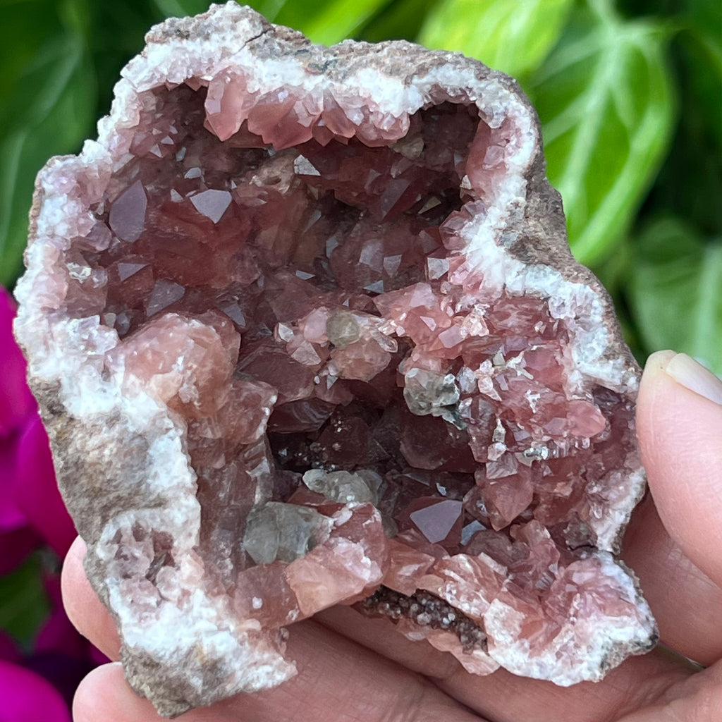 There is much to discover in this exceptional Pink Amethyst Geode specimen, including calcite crystals, some with manganese included, that also have a nice shine. 
