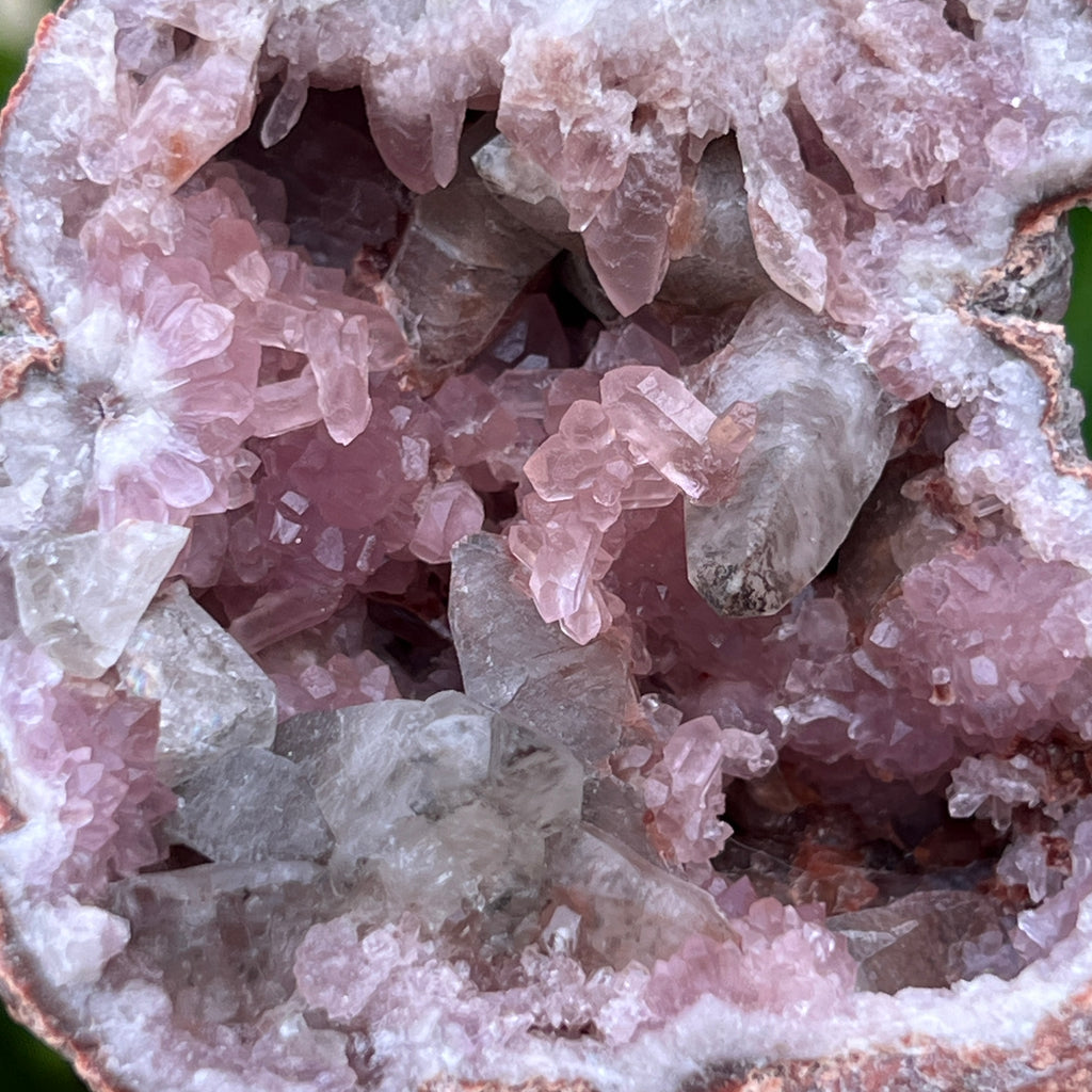 Here is another, closer look at the many gemmy Pink Amethyst crystals and fascinatingly shaped, stippled, etched, manganese included Calcite crystals in the smaller side of the geode.